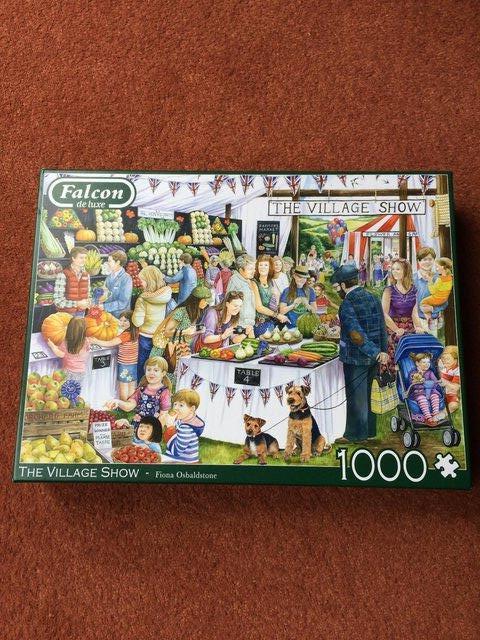 Preview of the first image of FALCON DE LUXE 1000 PIECE JIGSAW PUZZLE-THE VILLAGE SHOW.