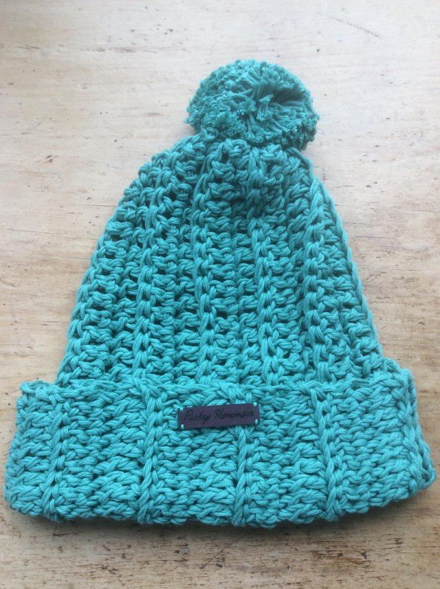 Preview of the first image of Hand crocheted Pom Pom beanie hats.