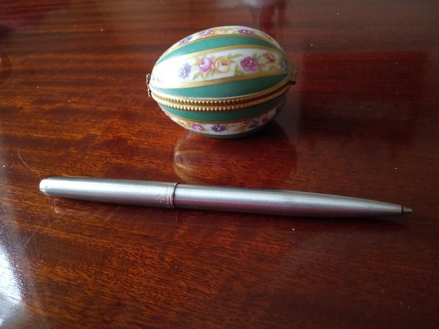 Preview of the first image of PORCELAIN LIMOGES EGG SHAPED TRINKET BOX.