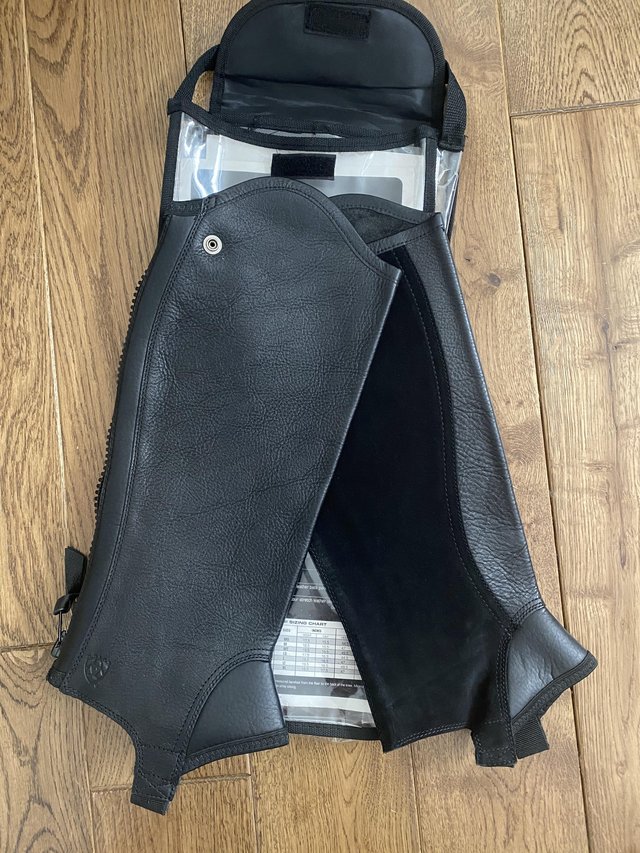 Preview of the first image of BNWT Ariat concord black leather chaps size Large Short.