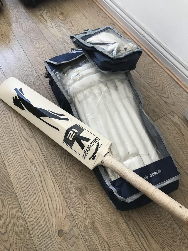 Preview of the first image of Cricket bat and bag with leg pads and gloves.