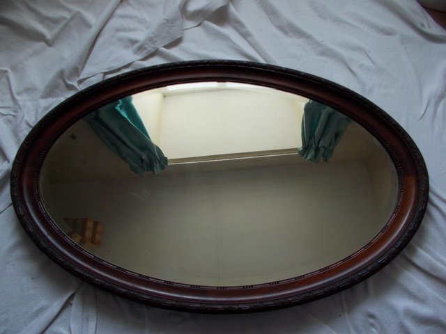 Preview of the first image of Large old Oval oak beveled mirror 1010mm wide x 660 high (F).