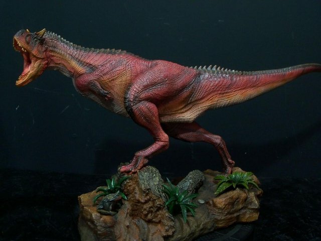 Preview of the first image of Damtoys Dinosaur Carnotaurus Red Exclusive Statue.