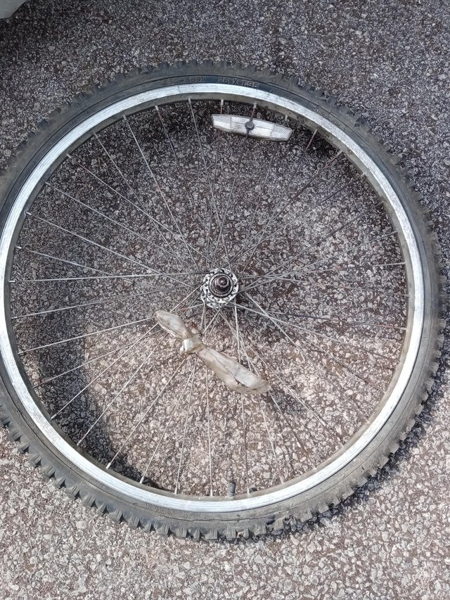 Preview of the first image of Alloy mountain bike front wheel, tyre, inner tube..