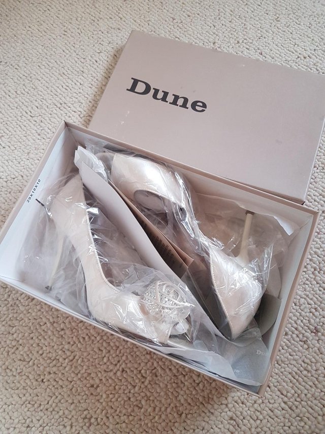Preview of the first image of Dune Cream Stiletto Dress Shoes, Size 6.