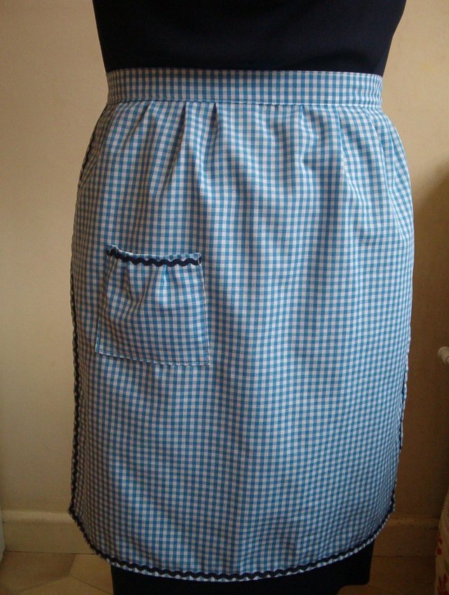 Preview of the first image of BLUE GINGHAM PINNY- POCKET - WITH NAVY RIC RAC / MADE UK.