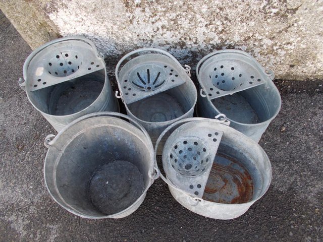 Preview of the first image of Old Galvanised mop buckets garden planters from £10 each.