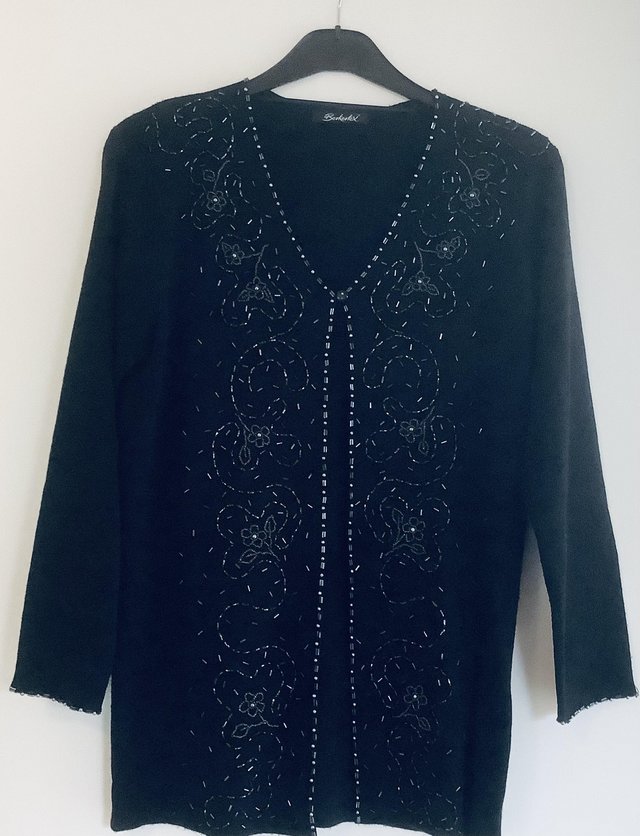 Preview of the first image of BERKERTEX Stunning V Necked Long Sleeved Black Cardigan..