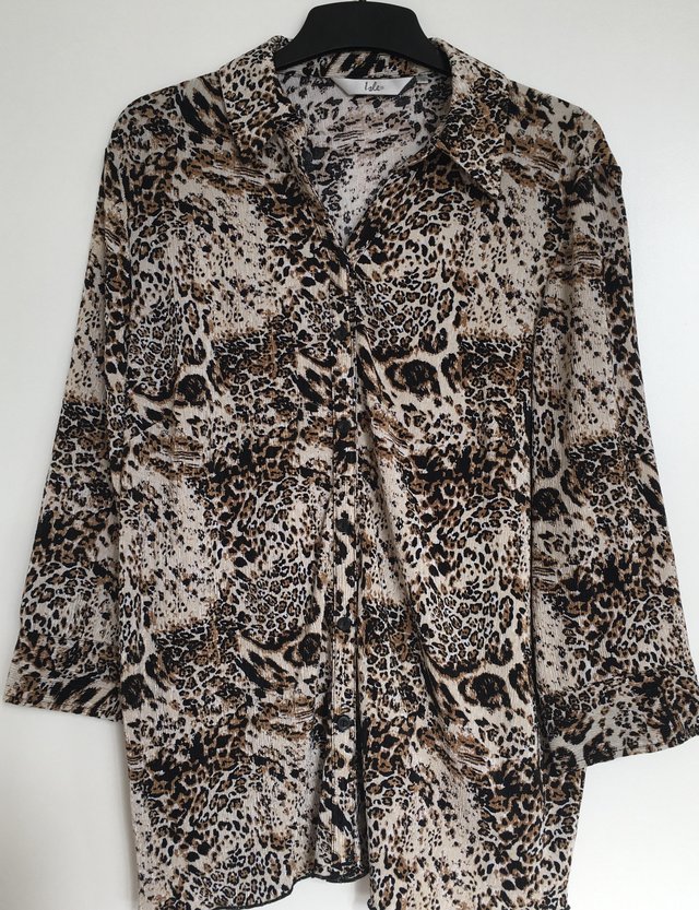 Preview of the first image of Isle by EWM Ladies Long-Sleeved Leopard Print Blouse.