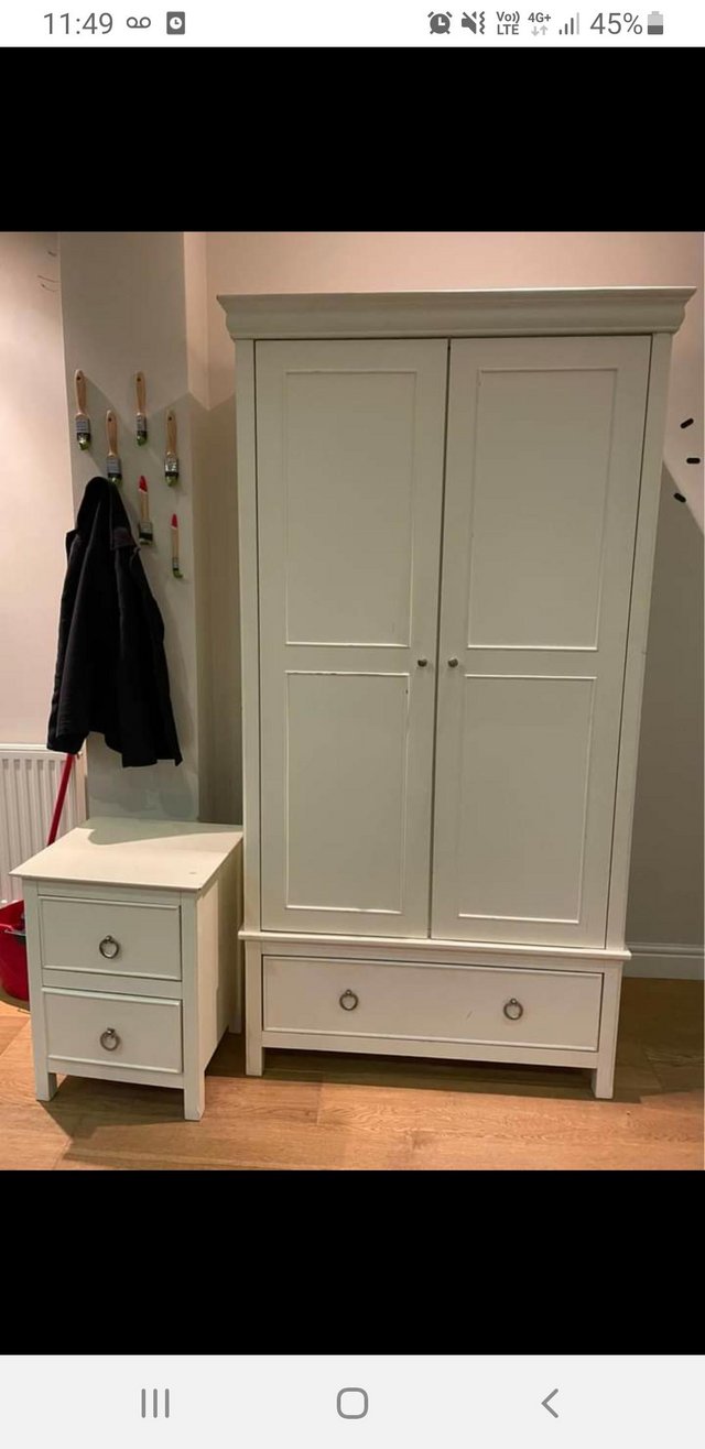 Preview of the first image of John Lewis Solid 2 door wardrobe ivory / cream colour.