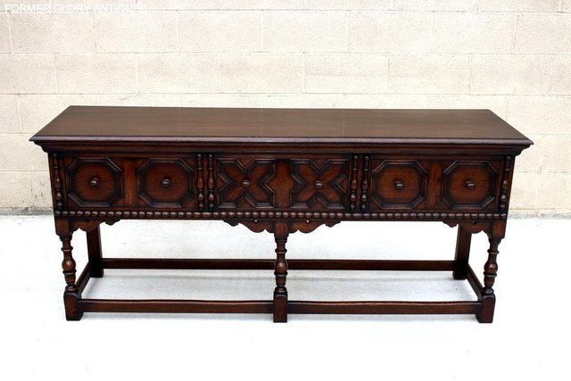 Preview of the first image of A JACOBEAN CARVED OAK SIDEBOARD DRESSER BASE HALL LAMP TABLE.