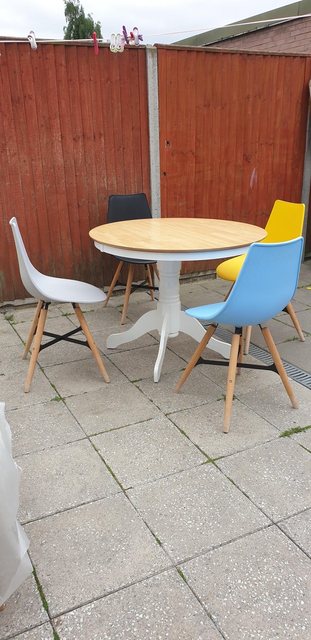 Preview of the first image of Modern round dining table and chairs.