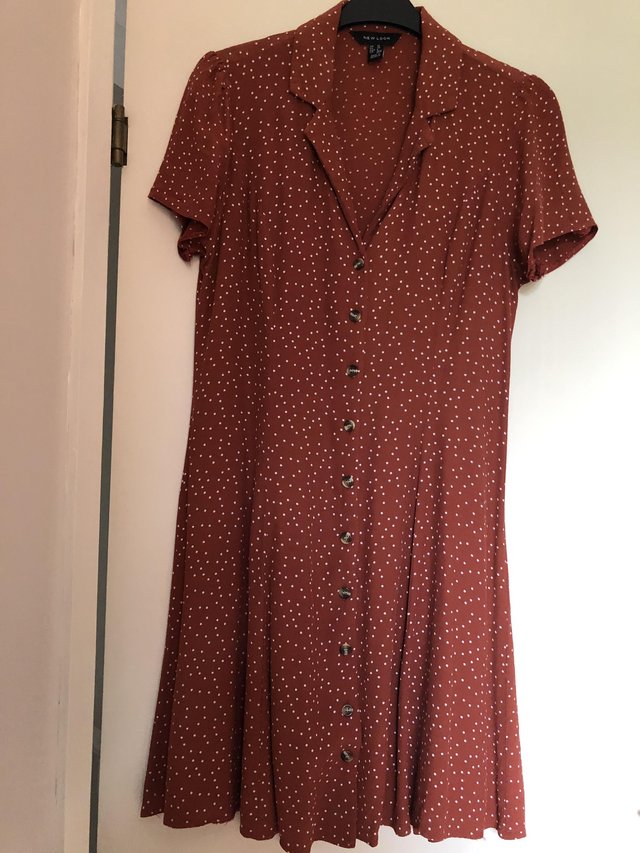Preview of the first image of Terracotta polka dot New Look dress.