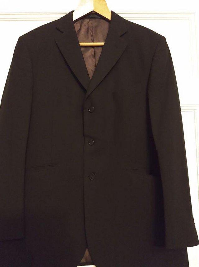 Preview of the first image of Marks & Spencers Black Jacket 42" chest,medium length.IMMACU.