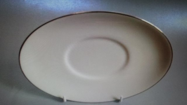 Preview of the first image of Royal Doulton 'Reflection' bone china saucer for gravy boat.