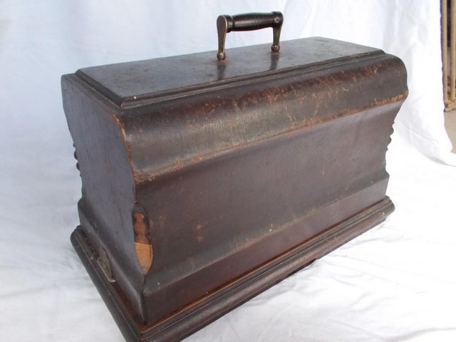 Preview of the first image of Singer Sewing carrying case with key, over 100 years old.