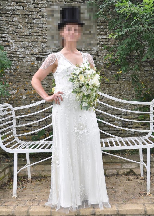 Preview of the first image of JENNY PACKHAM EDEN WEDDING DRESS IN IVORY SIZE 10.