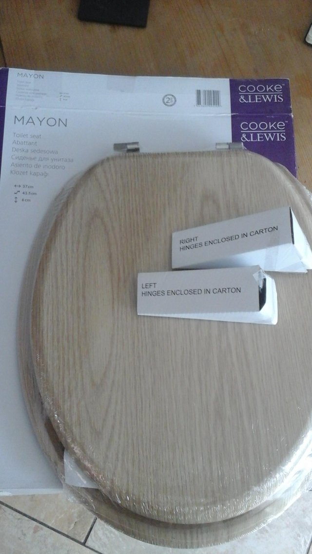 Preview of the first image of Brand new toilet seat boxed  with fittings.