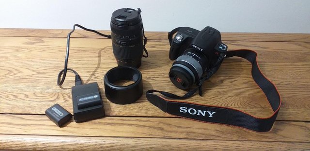 Preview of the first image of Camera with lenses, bag, batteries, battery charger.
