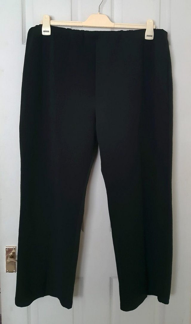 Preview of the first image of Ladies Plus Size Black Bootcut Trousers By Yours - Size 26.