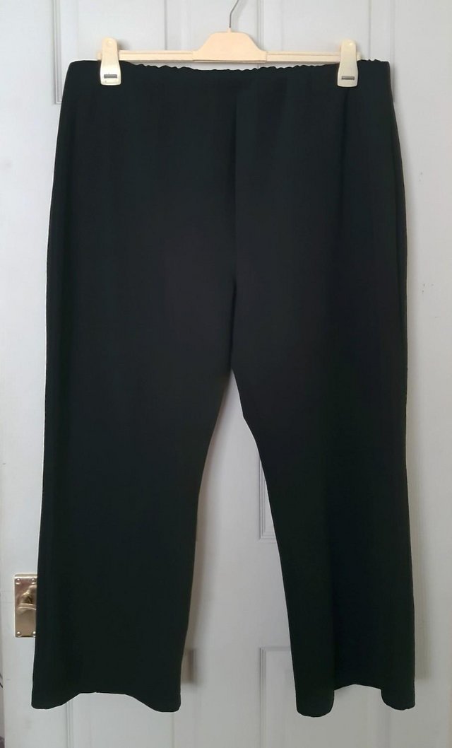 Preview of the first image of Ladies Plus Size Black Bootcut Trousers By Yours - Size 28.