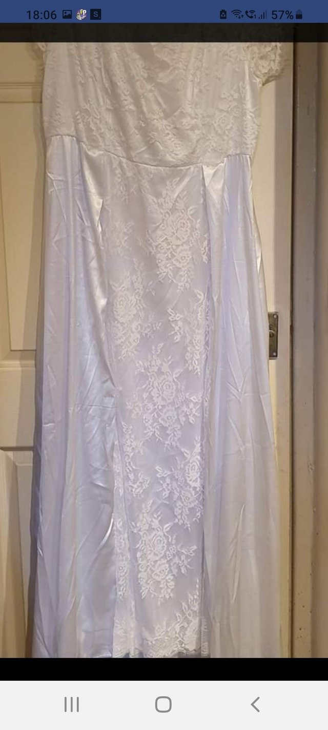 Preview of the first image of Worn once white lace and satin feel wedding dress.