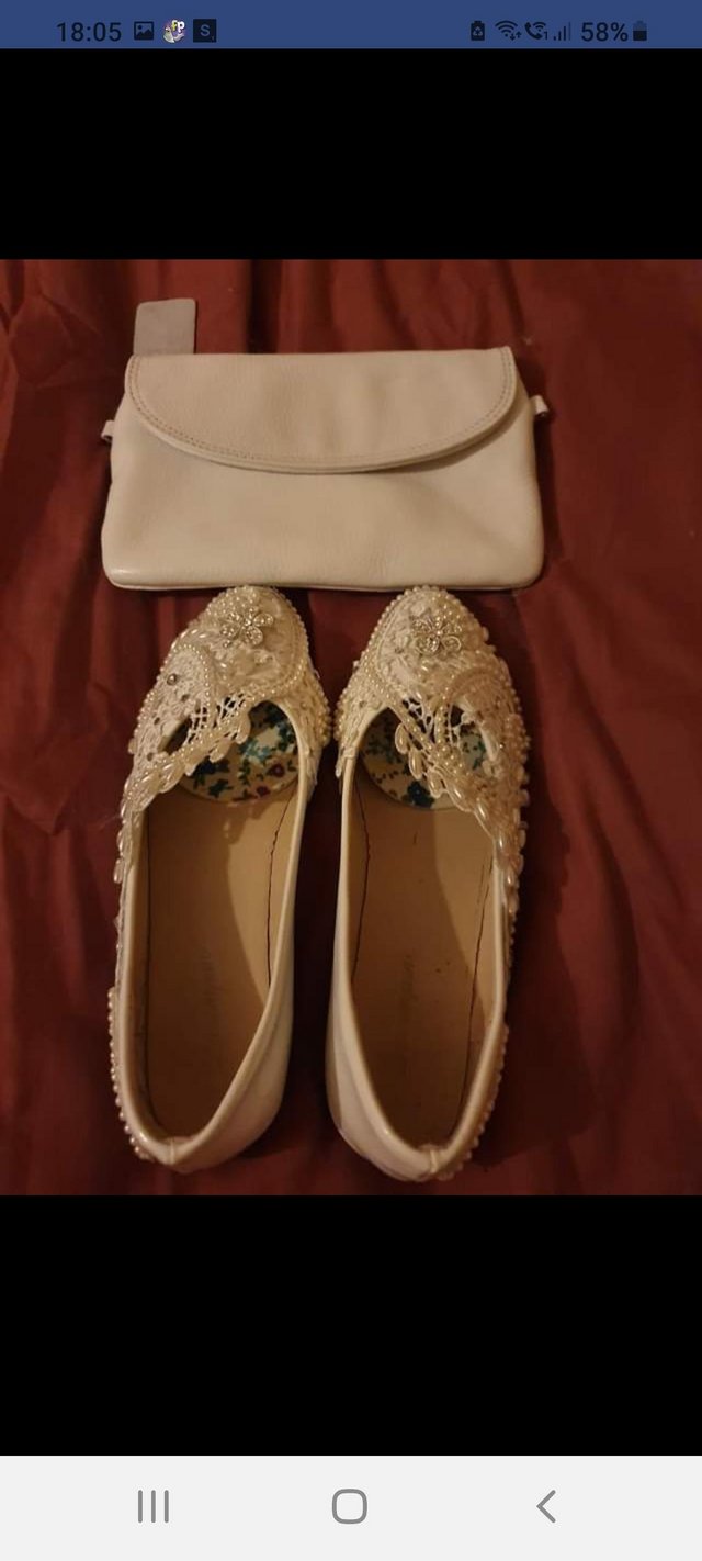 Preview of the first image of White wedding shoes and white handbag.