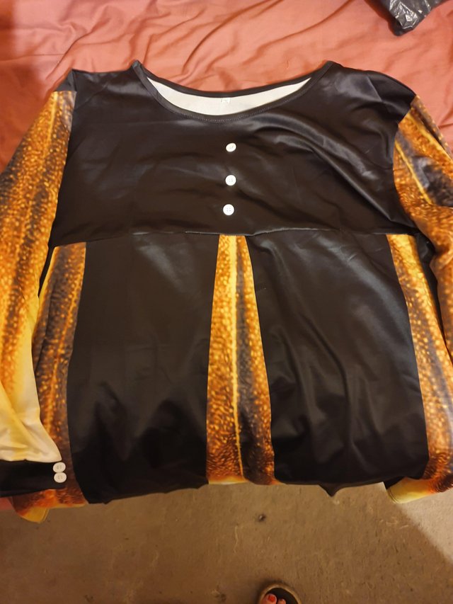 Preview of the first image of Black and gold size 20 tunic / blouse.