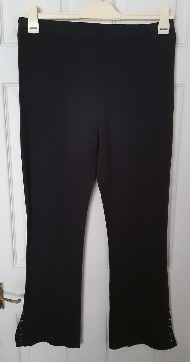 Preview of the first image of Essence Black Bootcut Leggings With Stud Detail - Size 18.