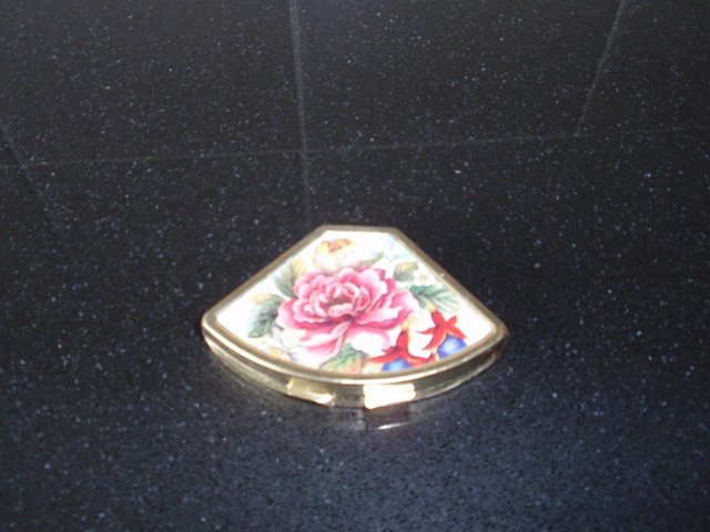 Preview of the first image of Fan Shaped Metal Pill Box with Floral Design on Lid.