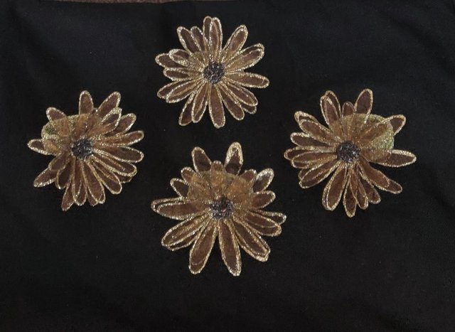 Preview of the first image of Set Of 4 Beautiful Glittered Flower Napkin Rings.