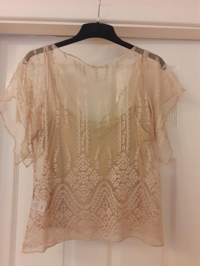 Preview of the first image of Ladies lace effect short sleeve top with a plain camisole.