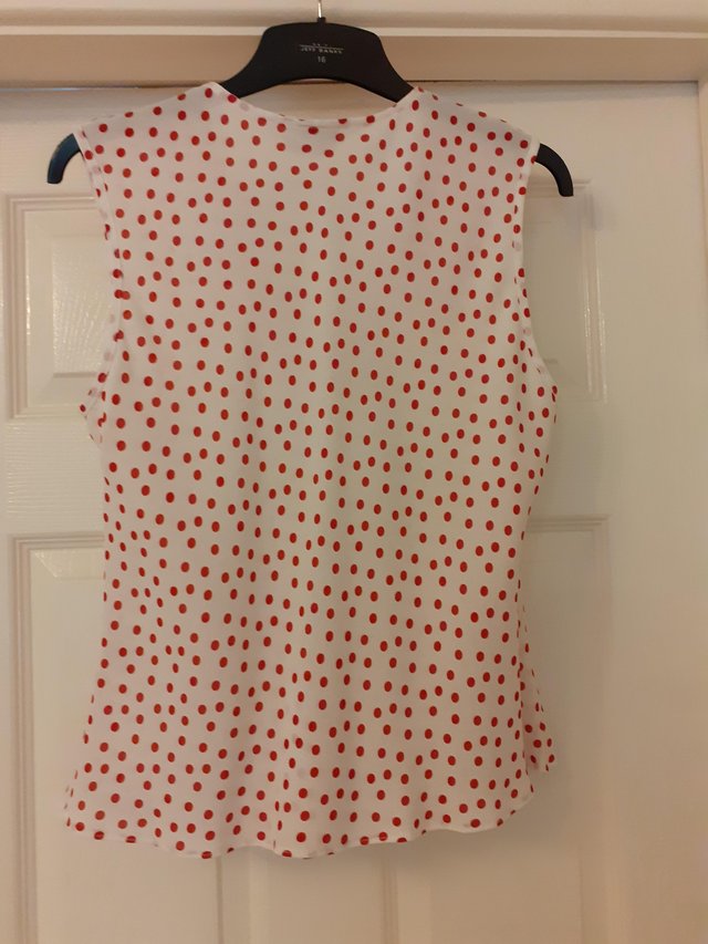 Preview of the first image of Ladies sleeveless polkadot top.