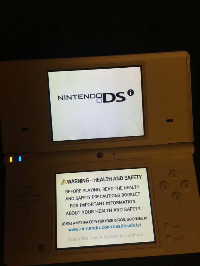 Preview of the first image of White Nintendo DSi Console & Official Charger and case.
