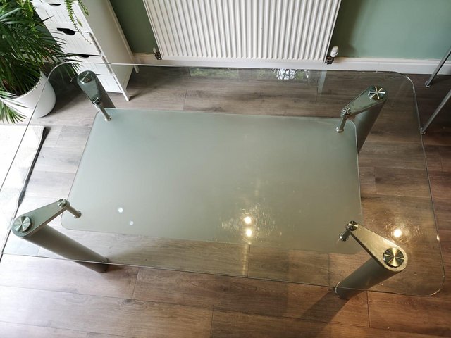 Preview of the first image of Glass dining table and chairs for sale.