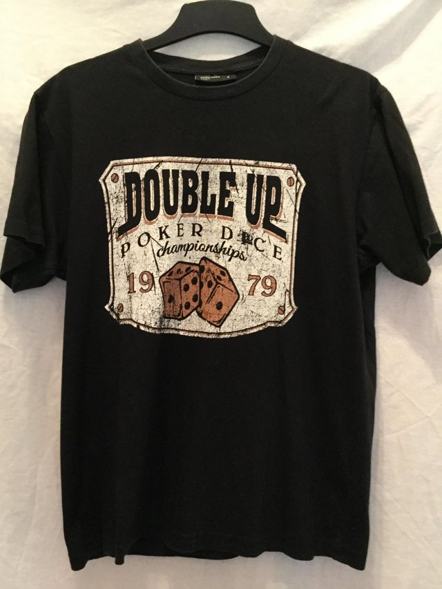 Preview of the first image of Black tee with ‘double up poker dice ‘ motif.