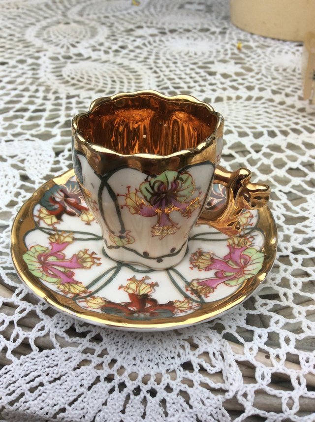 Preview of the first image of Small very decorative china cup and saucer.