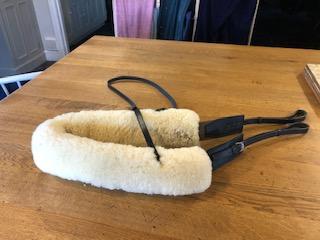 Preview of the first image of Albion Breast Girth - Black - Full Size with sheepskin cover.