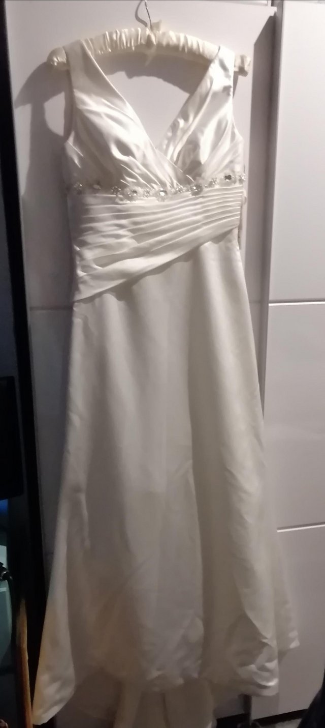 Preview of the first image of Ivory Wedding dress NEW size 12/14.