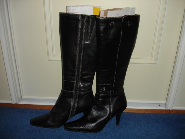 Preview of the first image of CLARKS BLACK LEATHER KNEE HIGH BOOTS.