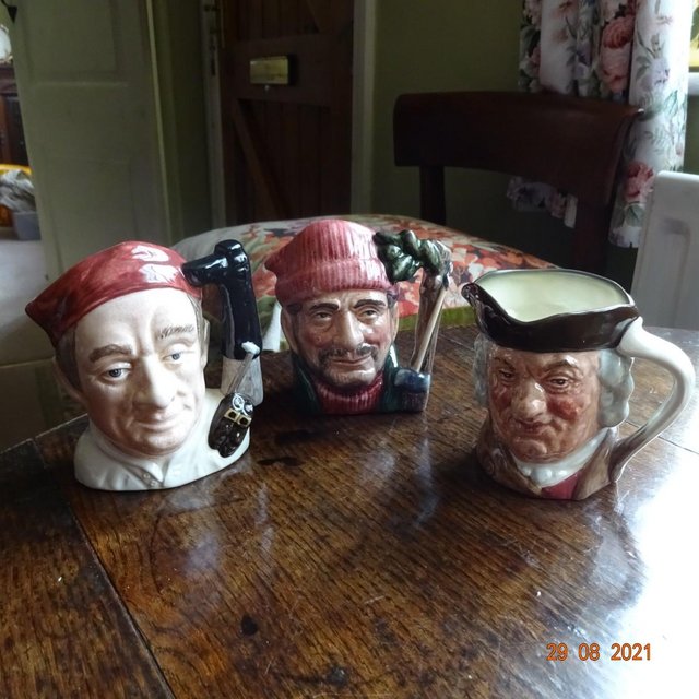 Preview of the first image of Three Toby Character Jugs by Royal Doulton.