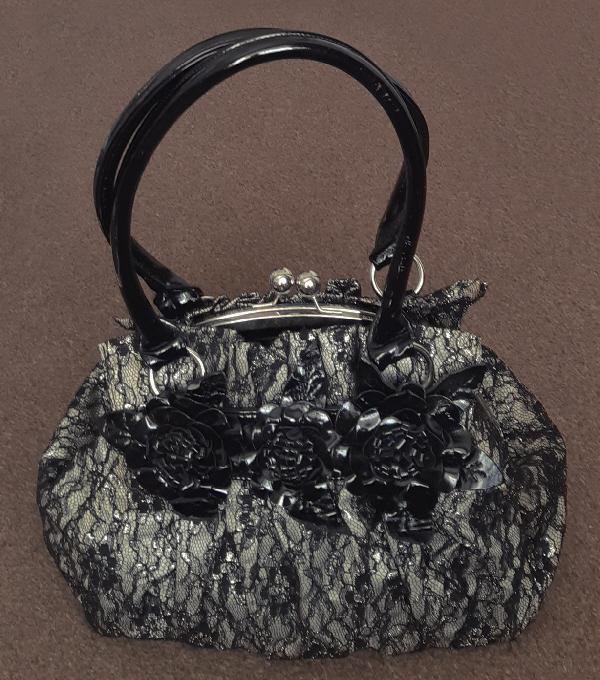 Preview of the first image of Large Vintage Black Lace Ladies Handbag.