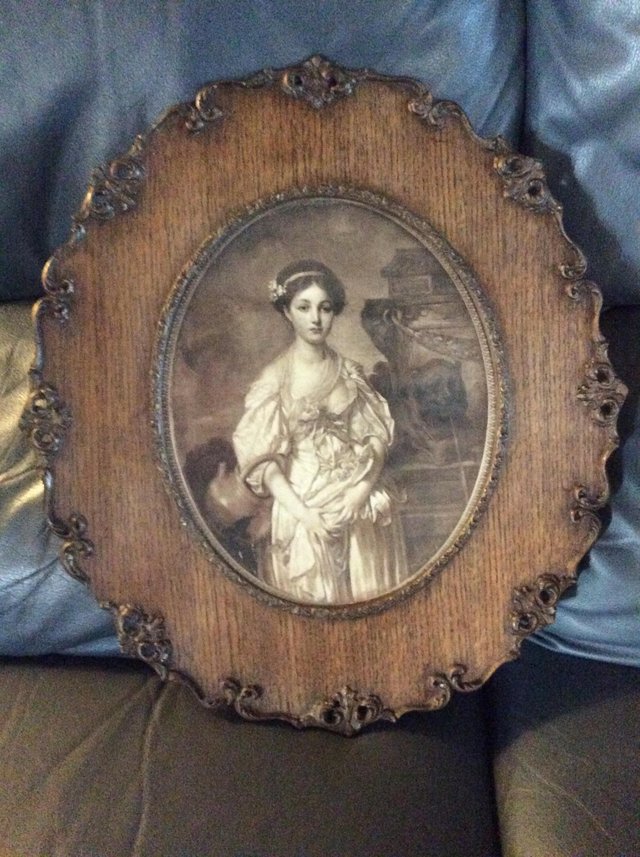 Preview of the first image of Antique Lithograph of girl in beautiful old frame..