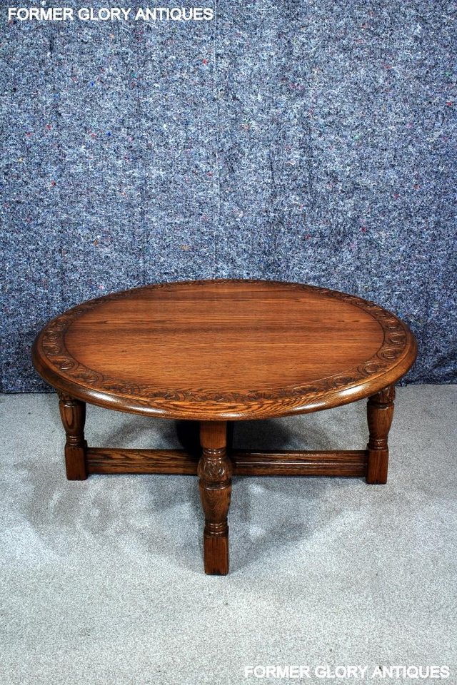 Image 37 of A LARGE ROUND JAYCEE AUTUMN GOLD CARVED OAK PUB COFFEE TABLE