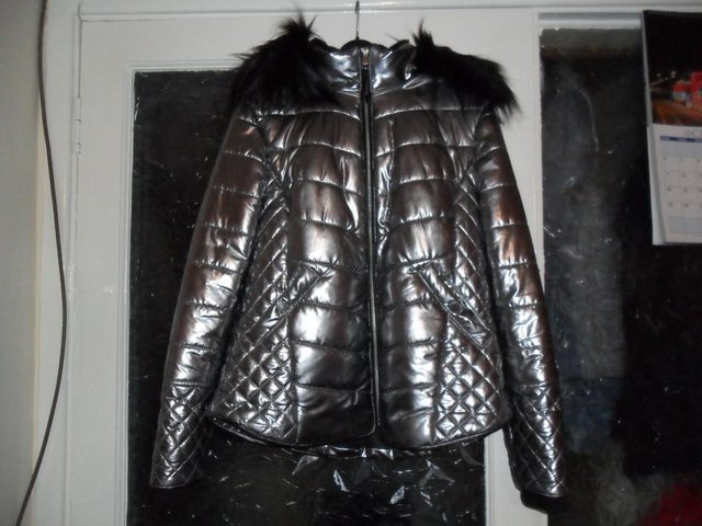 Preview of the first image of Ladies River Island metallic silver Padded jacket X 2,.