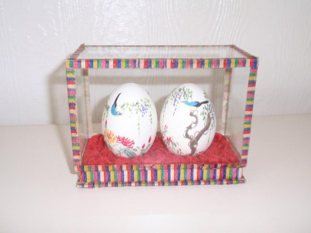 Preview of the first image of Set of two Chinese style painted eggs in display case.