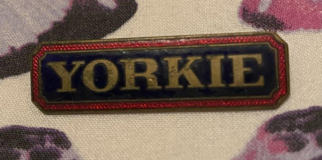 Preview of the first image of Very interesting 1970s Yorkie Badge.