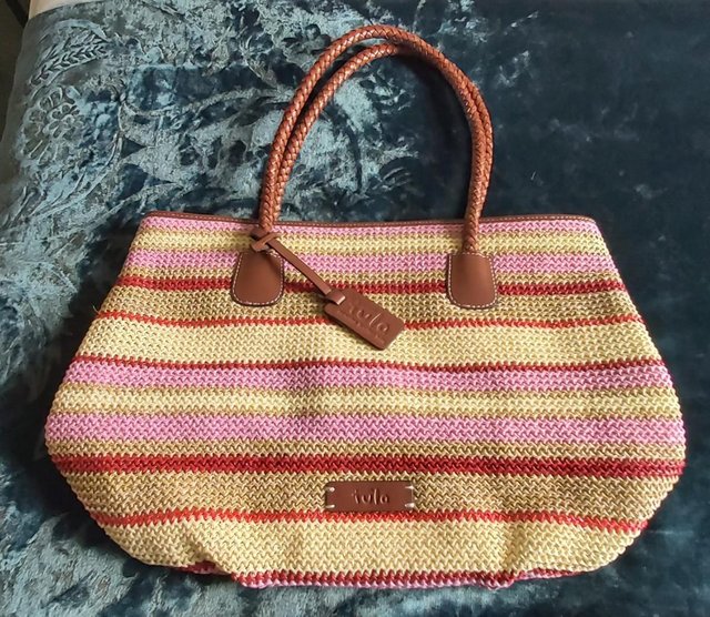 Preview of the first image of Tula Striped Straw Tote Bag with Leather Trim.