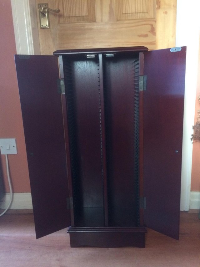 Preview of the first image of CD/ DVD dark mahogany cabinet.