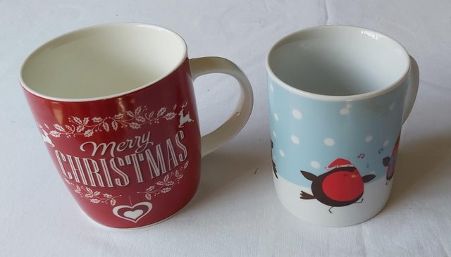 Preview of the first image of Two Different Styled Christmas Mugs.